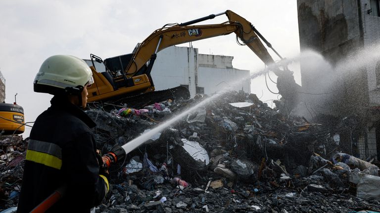 A firefighter works following the earthquake, in Hualien, Taiwan April 4, 2024. REUTERS/Tyrone Siu