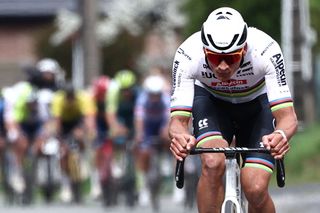 Alpecin - Deceuninck team's Dutch rider Mathieu Van Der Poel cycles in a lone breakaway ahead of the pack of riders during the 121st edition of the Paris-Roubaix one-day classic cycling race, 260km between Compiegne and Roubaix, northern France, on April 7, 2024. (Photo by Anne-Christine POUJOULAT / AFP)