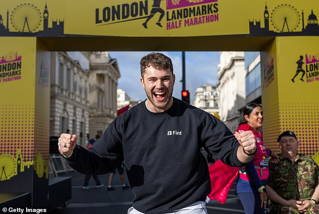 AJ's brother Curtis, 28, looked fit and ready to run the race as he stuck his arms in the air with a huge grin on his face