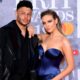 Alex Oxlade-Chamberlain and Perrie Edwards attending the Brit Awards 2019 at the O2 Arena, London. PRESS ASSOCIATION PHOTO. Picture date: Wednesday February 20, 2019. See PA story SHOWBIZ Brits. Photo credit should read: Ian West/PA Wire. EDITORIAL USE ONLY.