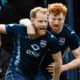 Josh Sims celebrates with Simon Murray after giving Ross County a 3-1 lead against Rangers