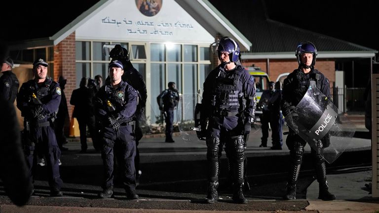 Pic: AP
Security officers stand guard outside Orthodox Assyrian church in Sydney, Australia, Monday, April 15, 2024. Police in Australia say a man has been arrested after a bishop and churchgoers were stabbed in the church. There are no life-threatening injuries. (AP Photo/Mark Baker)