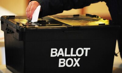 File photo of a voter placing a ballot paper in a ballot box at a polling station. Pic: PA