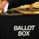 File photo of a voter placing a ballot paper in a ballot box at a polling station. Pic: PA