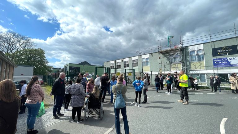 Parents wait at the gates of Amman Valley school, in Ammanford, Carmarthenshire.
Pic: PA