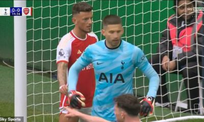 Ben White has been caught undoing the gloves of Spurs goalkeeper Guglielmo Vicario