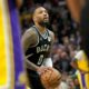 Milwaukee Bucks guard Damian Lillard (0) makes a free throw during the first overtime of their game Tuesday March 26, 2024 at Fiserv Forum in Milwaukee, Wisconsin. The Los Angeles Lakers beat the Milwaukee Bucks 128-124 in double overtime.