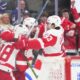 Red Wings center Dylan Larkin scores the winning goal and celebrates with right wing Alex DeBrincat (93) during the overtime period of the Red Wings' 5-4 win on Saturday, April 13, 2024, in Toronto.