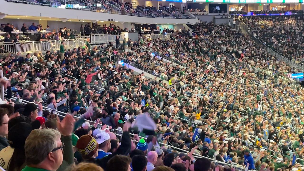 Fans cheer on Milwaukee Bucks during playoff game