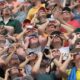 People watch the solar eclipse at Saluki Stadium on the campus of Southern Illinois University on August 21, 2017 in Carbondale, Ill.