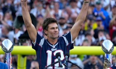 Tom Brady acknowledges his fans during a halftime celebration and the announcement of his induction in the the Patriots Hall of Fame.