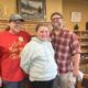 McKenna and her parents at the Massena Public Library. Photo: Monica Sandreczki