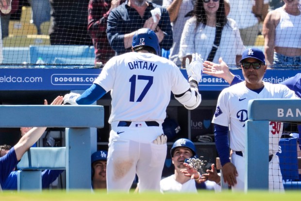 Los Angeles Dodgers designated hitter Shohei Ohtani returns to the...