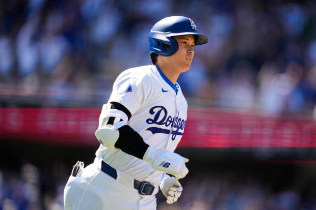 Los Angeles Dodgers designated hitter Shohei Ohtani runs the bases...