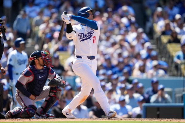 Los Angeles Dodgers designated hitter Shohei Ohtani (17) hits a...