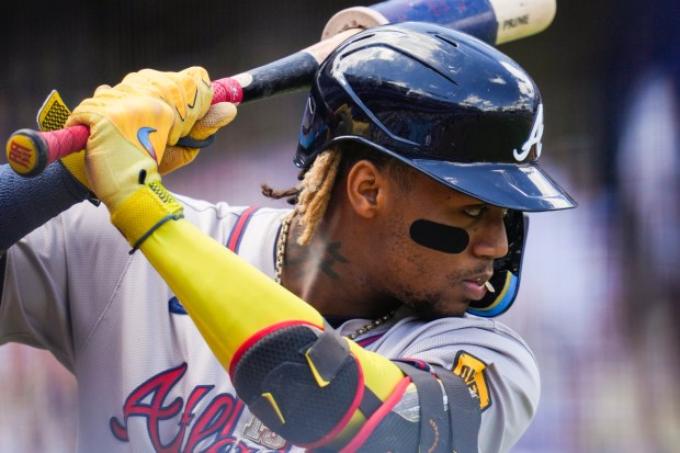 Atlanta Braves’ Ronald Acuña Jr. warms up before a baseball...