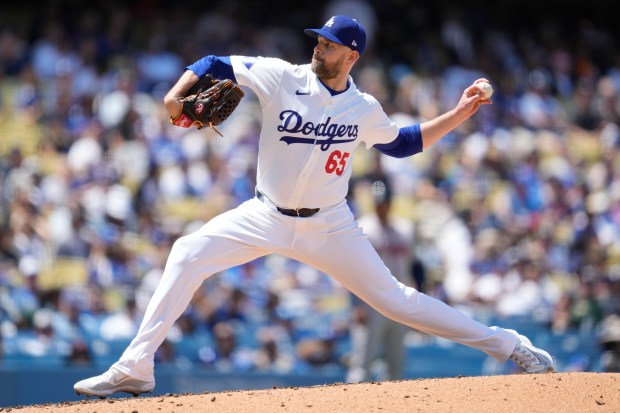 Los Angeles Dodgers starting pitcher James Paxton (65) throws during...