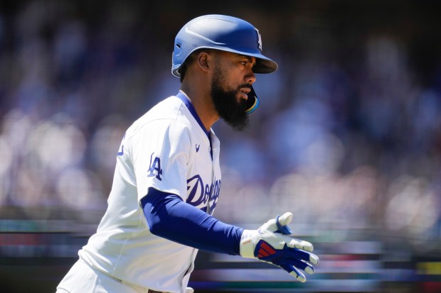 Los Angeles Dodgers’ Teoscar Hernández runs the bases after hitting...