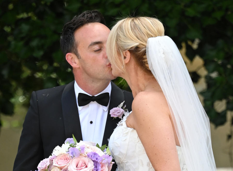 HOOK, HAMPSHIRE - AUGUST 07: (EMBARGOED FOR PUBLICATION IN UK NEWSPAPERS UNTIL 24 HOURS AFTER CREATE DATE AND TIME) Ant McPartlin and Anne-Marie Corbett pose for the photographers after their wedding at St Michaels Church in Heckfield on August 07, 2021 in Hook, Hampshire. (Photo by Karwai Tang/WireImage)