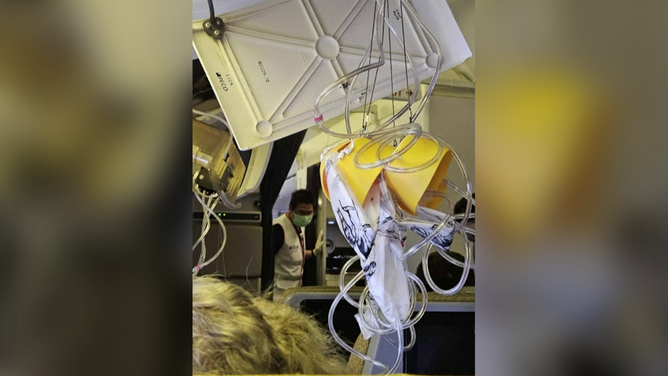 This photo shows oxygen masks that feel during severe turbulence on board a Singapore Airlines flight on Monday, May 20, 2024.