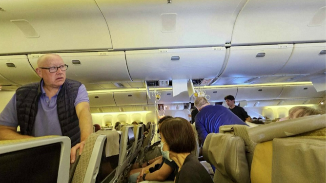 This photo shows oxygen masks that feel during severe turbulence on board a Singapore Airlines flight on Monday, May 20, 2024.