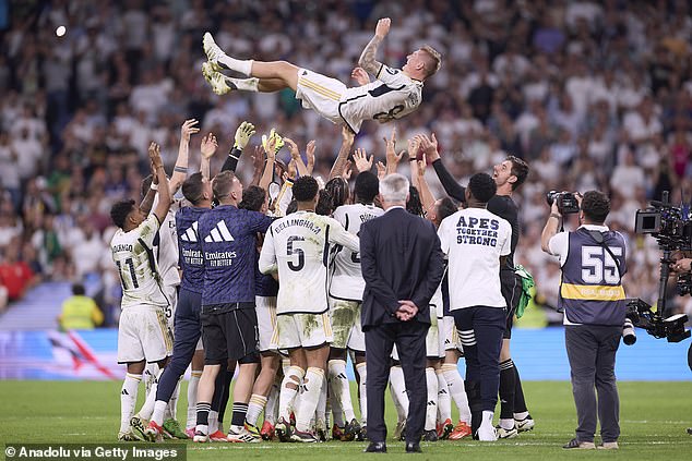 The Germany international was thrown into the air by his Madrid team-mates at the end of the game