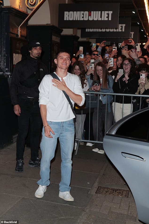 Tom, 27, looks grateful for his fans as he gets into a silver car after his West End performance