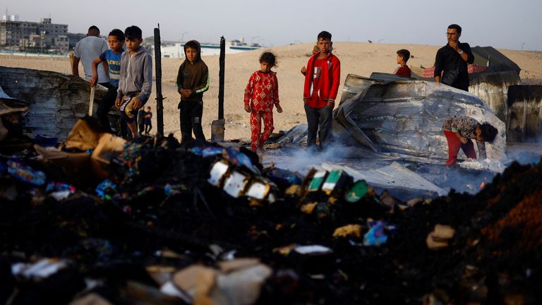 Pic: Reuters
Palestinians look at the damages after a fire at the site of an Israeli strike on an area designated for displaced people, in Rafah in the southern Gaza Strip, May 27, 2024. REUTERS/Mohammed Salem