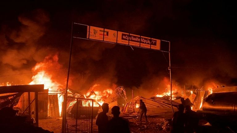 Fire rages following an Israeli strike on an area designated for displaced Palestinians, amid the ongoing conflict between Israel and Hamas, in Rafah in the southern Gaza Strip, in this still picture taken from a video, May 26, 2024. REUTERS/Reuters TV TPX IMAGES OF THE DAY
