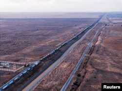 A drone picture of a line of trucks waiting on an Egyptian road along the border with Israel, near the Rafah border crossing with the Gaza Strip, May 2, 2024.