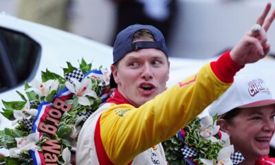 INDIANAPOLIS, IN - MAY 26: IndyCar driver Josef Newgarden holds up 2 fingers for his second consecutive Indy 500 win after winning the 108th running of the Indianapolis 500 on May 26, 2024, at the Indianapolis Motor Speedway in Indianapolis, Indiana. (Photo by Brian Spurlock/Icon Sportswire) (Icon Sportswire via AP Images)