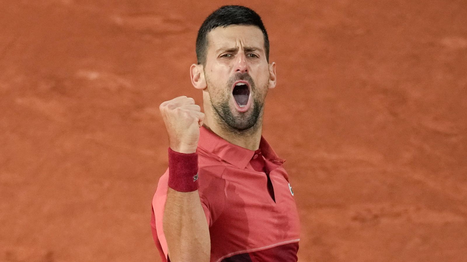 Serbia's Novak Djokovic clenches his fist after scoring a point against France's Pierre-Hugues Herbert during their first round match of the French Open tennis tournament at the Roland Garros stadium in Paris, Tuesday, May 28, 2024. (AP Photo/Christophe Ena)