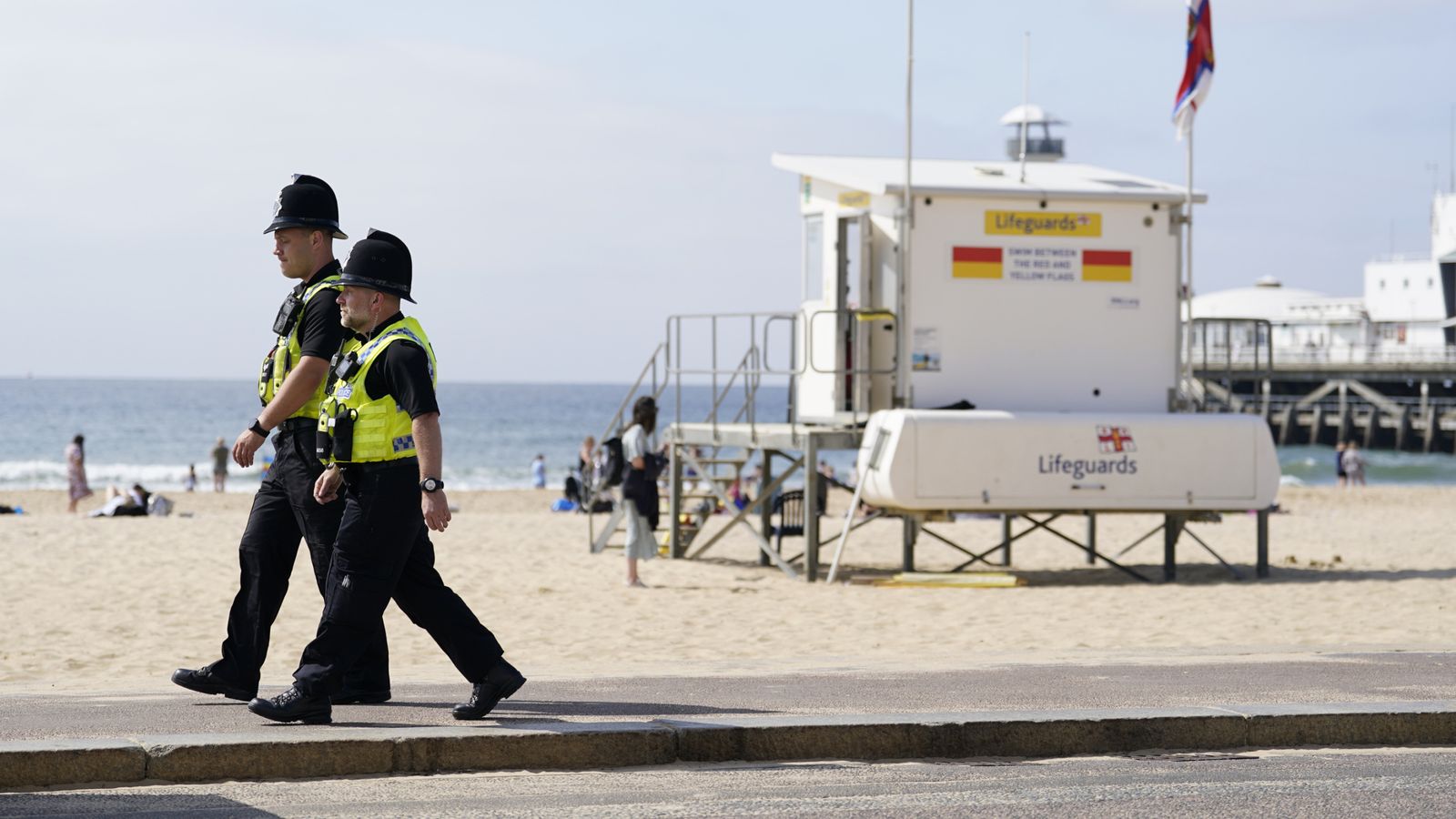 File photo dated 01/06/23 of police officers walking along a stretch of Bournemouth sea front. A woman has died after being stabbed on a beach in Bournemouth. Dorset Police said they were called to reports two women, both from Poole, had been stabbed on Durley Chine Beach around 11.45pm on Friday. Issue date: Saturday May 25, 2024.