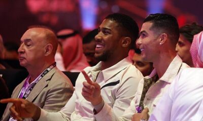 Cristiano Ronaldo and Anthony Joshua were spotted sharing a laugh at ringside