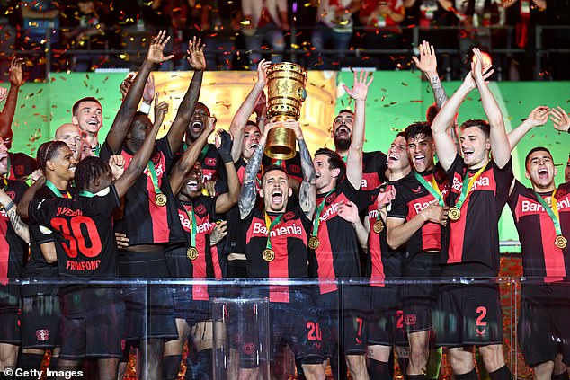 Bayer Leverkusen celebrate winning the DFB Pokal to bag an undefeated German double