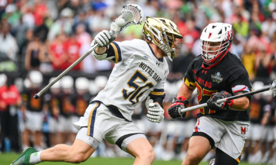 Notre Dame attackman Chris Kavanagh (50) sprints past Maryland long pole Will SchallerHear how to pronounce Will Schaller in NCAA championship game action at Lincoln Financial Field in Philadelphia.