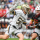 Notre Dame attackman Chris Kavanagh (50) sprints past Maryland long pole Will SchallerHear how to pronounce Will Schaller in NCAA championship game action at Lincoln Financial Field in Philadelphia.