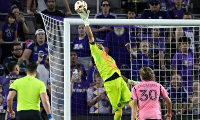 Orlando City goalkeeper Pedro Gallese, middle, makes a save as Inter Miami midfielder Benjamin Cremaschi (30) watches during the first half of an MLS soccer match Wednesday, May 15, 2024, in Orlando, Fla. (AP Photo/Phelan M. Ebenhack)