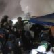 Police raid UCLA protest camp as clashes over Gaza spread across US