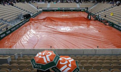 Play has been suspended on uncovered courts at Roland Garros due to rain.