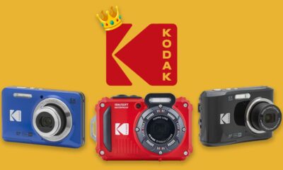 A selection of Kodak cameras, against a yellow background, with the red Kodak logo wearing a miniature crown