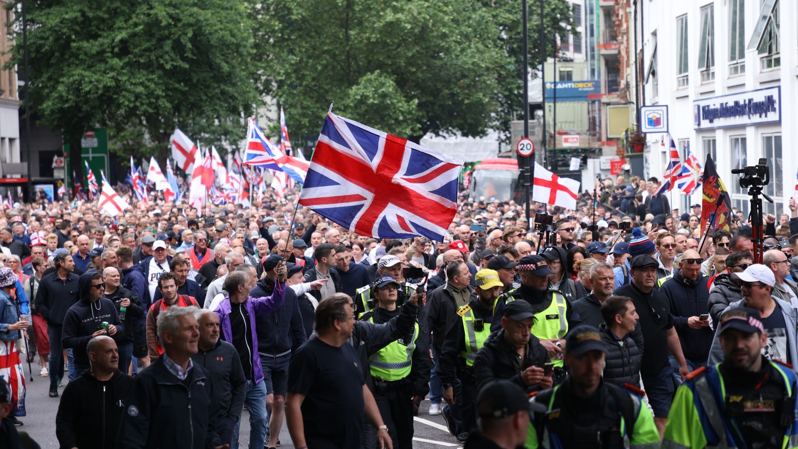 Police among protesters at Tommy Robinson march. Pic: PA