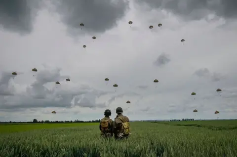 Christopher Furlong/Getty Images Paratroopers land at Sannerville