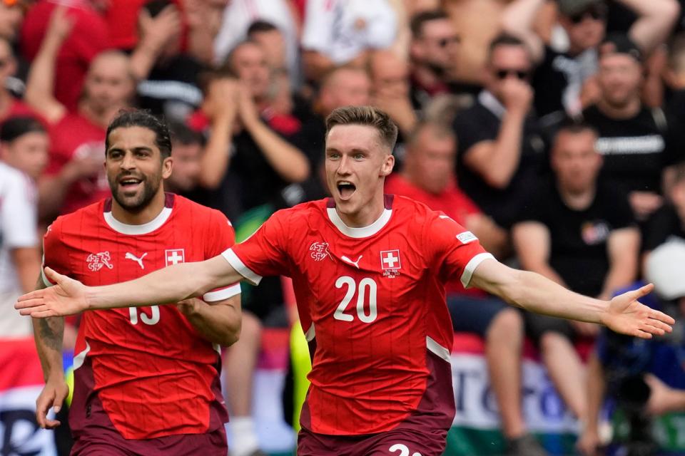 Switzerland's Michel Aebischer celebrates (AP)