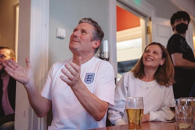 Sir Keir was not wearing an England-branded shirt, even though he is known to own one (picture watching a match in 2021)