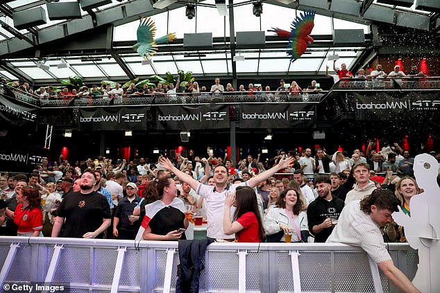 England fans cheer on the Three Lions at the Greenwich Fan Zone