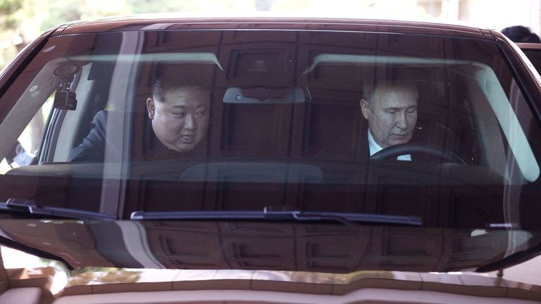 Vladimir Putin and North Korea's leader Kim Jong Un ride an Aurus car in Pyongyang, North Korea.
Pic: Reuters