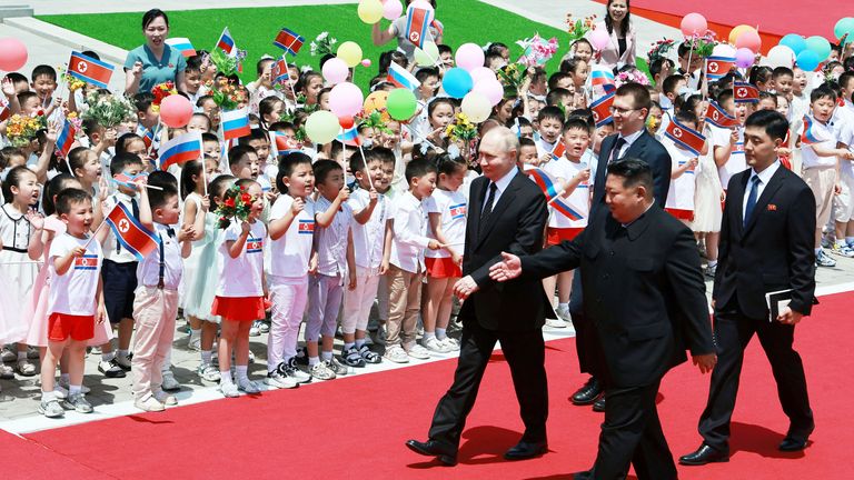 Vladimir Putin and Kim Jong Un attend an official welcoming ceremony at Kim Il Sung Square in Pyongyang, North Korea.
Pic:Sputnik/Reuters