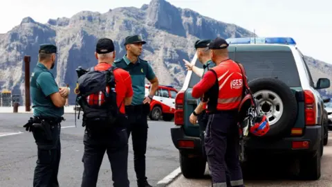 Reuters A meeting on a road in mountain as search for missing Brit continues in Tenerife