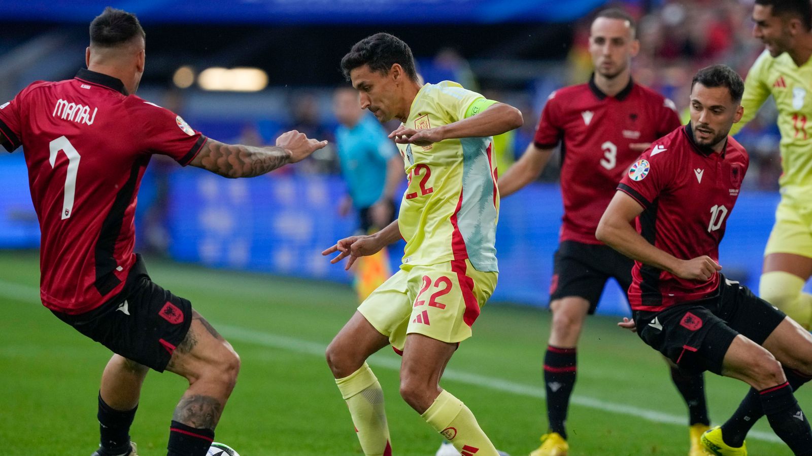 Spain's Jesus Navas, center, duels for the ball with Albania's Rey Manaj